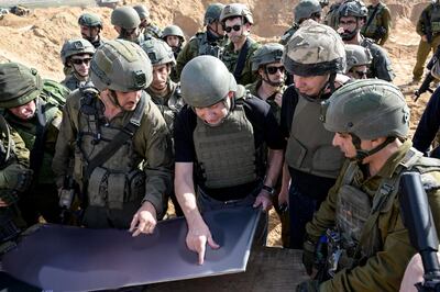 Israeli Prime Minister Benjamin Netanyahu (C) meets soldiers at an undisclosed location in the Gaza Strip. AFP