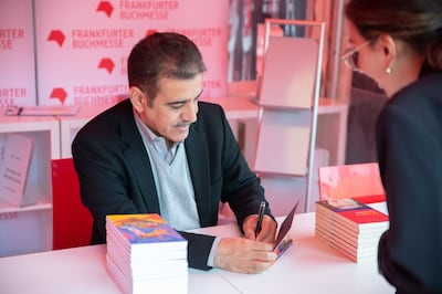 Saudi author Yousef Al Mohaimeed signs German translations of his novels at the Frankfurt Book Fair. Photo: Ithra