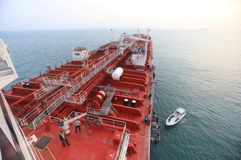 A boat of Iranian Revolutionary Guard is seen next to Stena Impero, a British-flagged vessel owned by Stena Bulk, at Bandar Abbas port, in this undated handout photo. Iran, ISNA/WANA Handout via REUTERS ATTENTION EDITORS - THIS IMAGE WAS PROVIDED BY A THIRD PARTY.