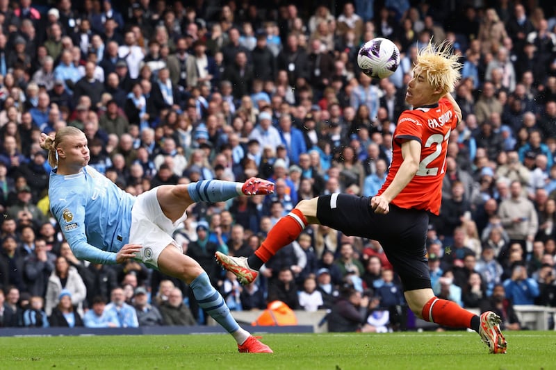 Manchester City striker Erling Haaland's shot is deflected into the net off Luton Town's Daiki Hashioka for the opening goal. AFP