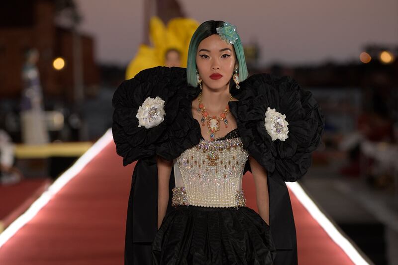 A model presents a look from Dolce & Gabbana's Alta Moda collection in Venice, Italy.