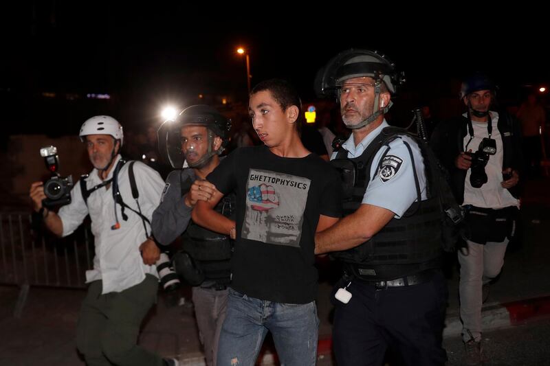 Israeli police arrest a Palestinian activist during a demonstration in support of Palestinian families that face eviction from their homes at Sheikh Jarrah neighbourhood, near Damascus Gate in the Old City of Jerusalem. EPA