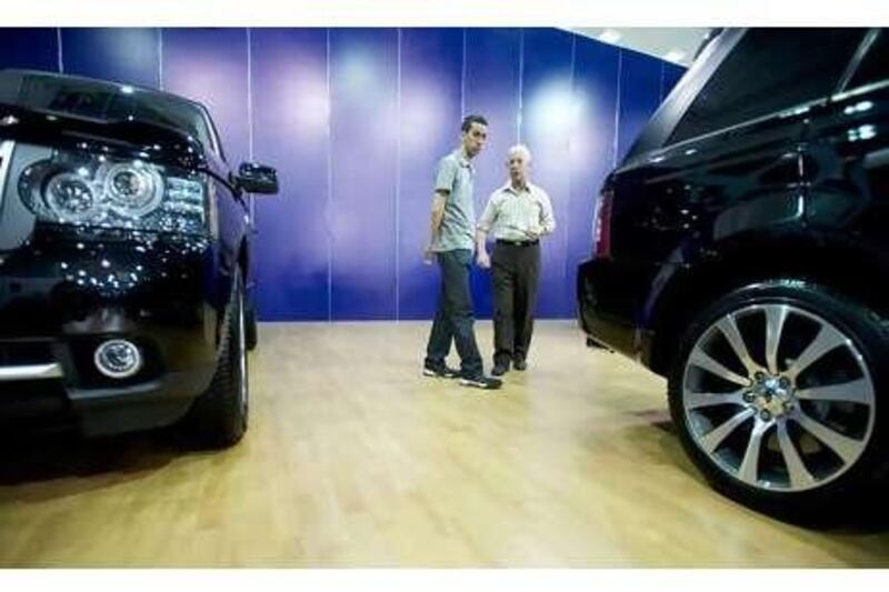 Range Rovers, on display at an auto show in Damascus this month, are in high demand despite a steep luxury tax.