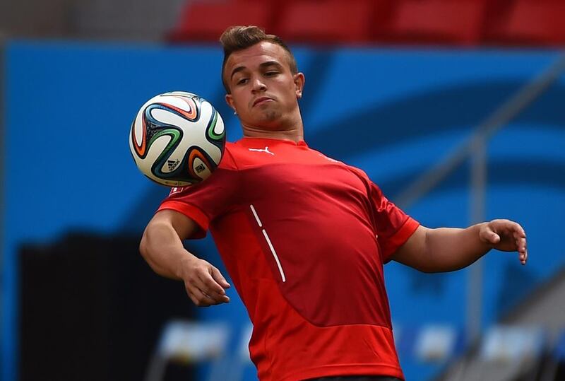 Switzerland midfielder Xherdan Shaqiri controls the ball during a training session in Brasilia on June 14, 2014, ahead of their Group E match against Ecuador on June 15 in the 2014 Fifa World Cup. Anne-Christine Poujoulat / AFP