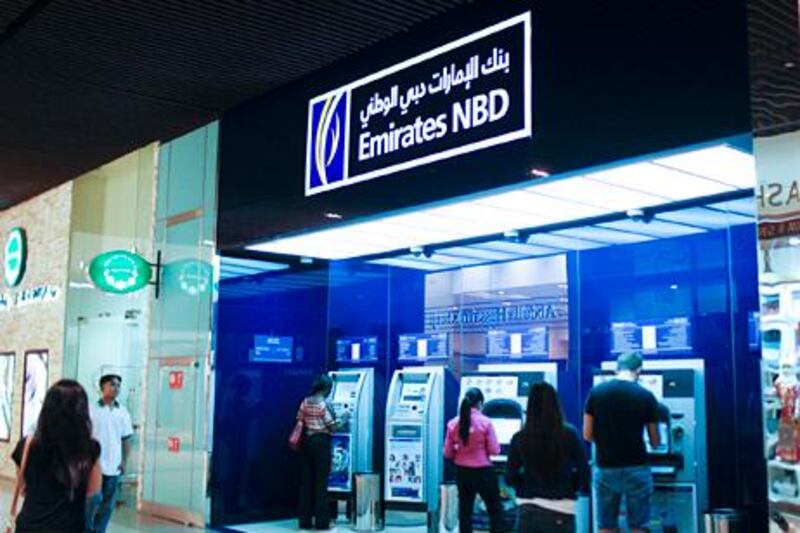 Dubai, September 27, 2012 -- STOCK of shoppers using Emirates NBD ATM machines Dubai Mall, September 30, 2012. Photo by: Sarah Dea/The National)