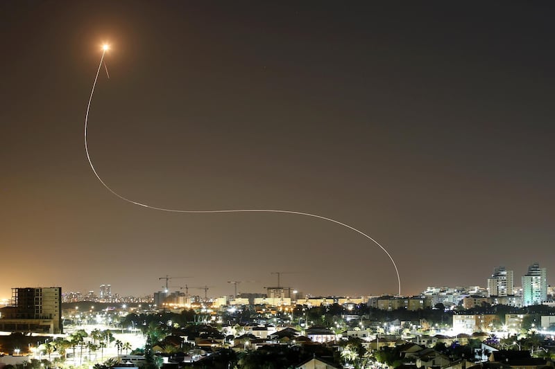 A streak of light is seen as Israel's Iron Dome anti-missile system intercepts rockets launched from the Gaza Strip towards Israel, as seen from Ashkelon. Reuters