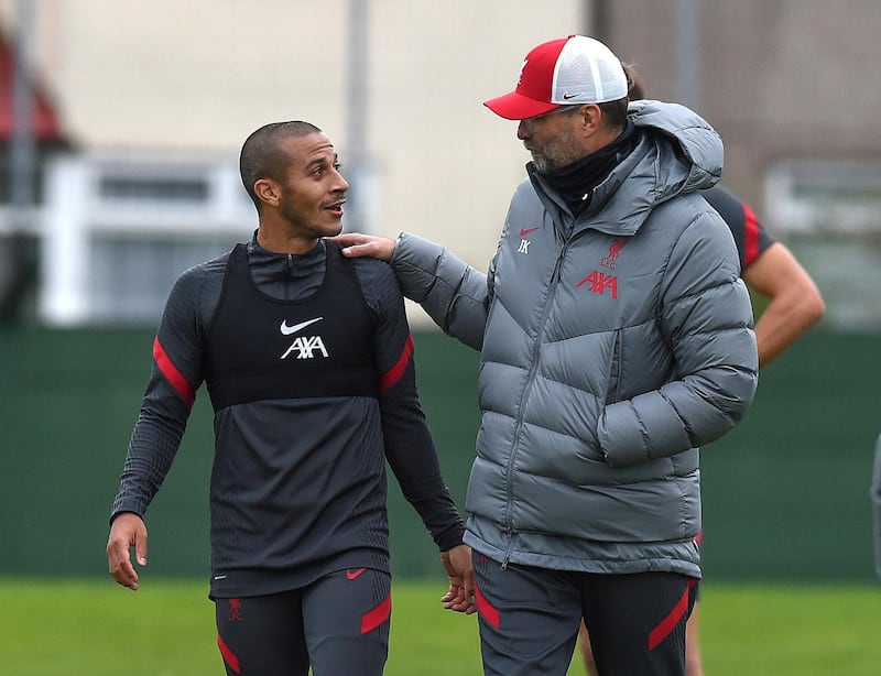 LIVERPOOL, ENGLAND - OCTOBER 13: (THE SUN OUT. THE SUN ON SUNDAY OUT) Jurgen Klopp manager of Liverpool with Thiago Alcantara of Liverpool  during a training session at Melwood Training Ground on October 13, 2020 in Liverpool, England. (Photo by John Powell/Liverpool FC via Getty Images)