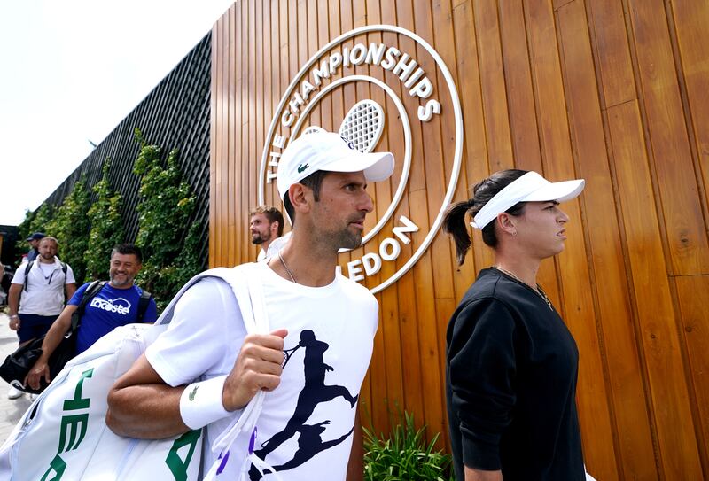 Novak Djokovic makes his way to a practice session ahead of Wimbledon. PA