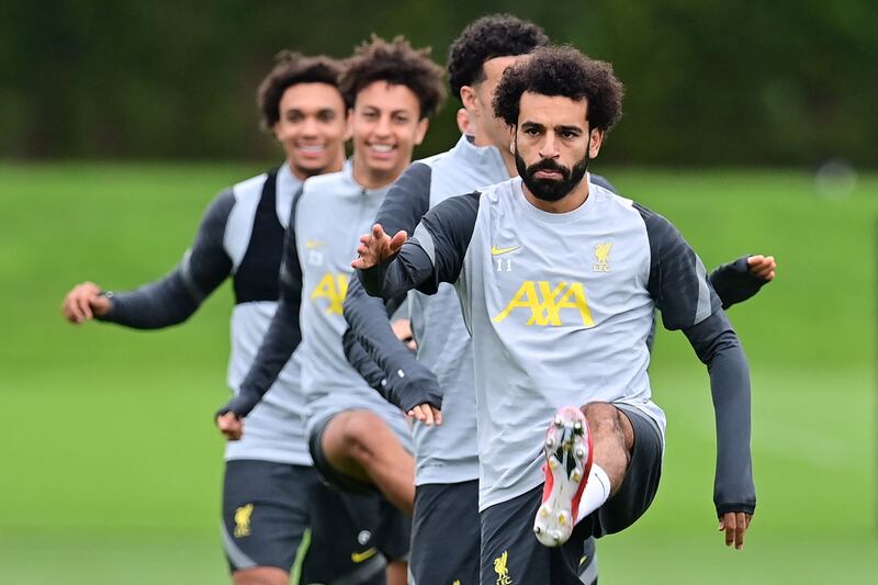 Liverpool's Egyptian midfielder Mohamed Salah (R) and teammates attend a training session at the Axa training centre in Kirkby, north of Liverpool in north-west England on September 14, 2021, on the eve of their UEFA Champions League, Group B football match against AC Milan.  (Photo by Paul ELLIS  /  AFP)