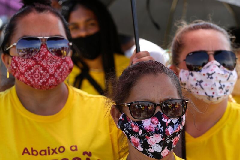 Brazilian vendors protest against the government's labour restrictions to curb the spread of the new coronavirus pandemic, and unemployment, at a bus terminal in Brasilia, Brazil. AP