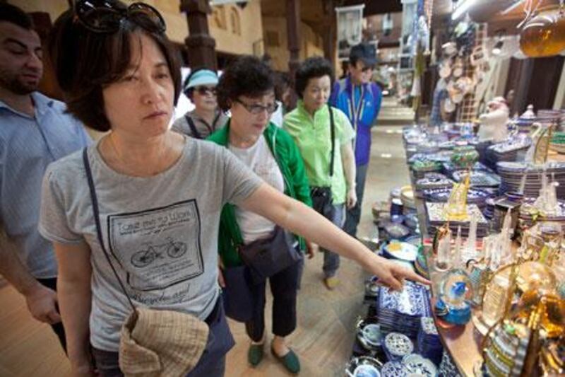 Dubai, United Arab Emirates, May 23, 2013 -   Tourists from South Korea shopping at the souk madinat jumeirah. ( Jaime Puebla / The National Newspaper ) 