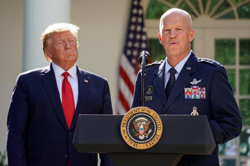 U.S. President Donald Trump listens as U.S. Air Force Gen. John Raymond, commander of SPACECOM, speaks during an an event to officially launch the United States Space Command in the Rose Garden of the White House in Washington, U.S., August 29, 2019. REUTERS/Kevin Lamarque