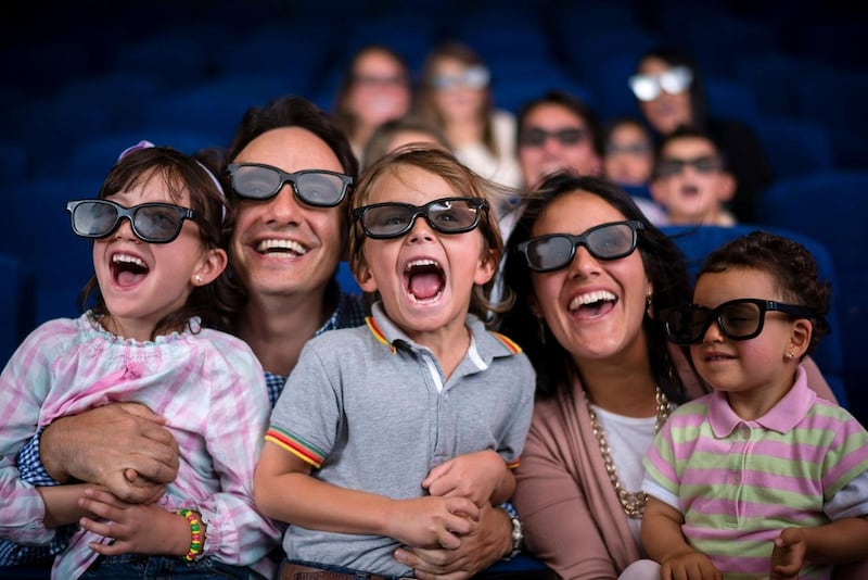 Family at the cinema enjoying a 4D experience