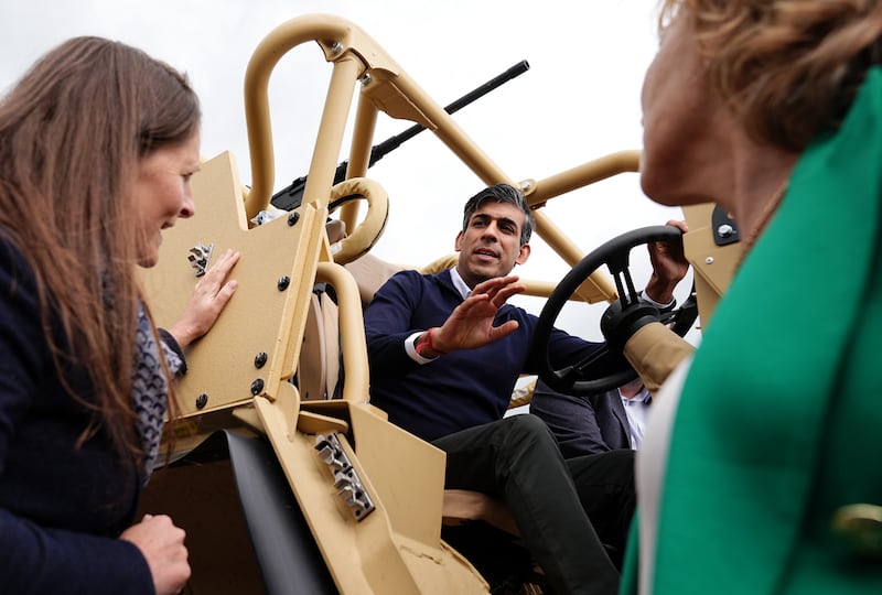 Rishi Sunak examines Jackal armoured vehicles during his visit to defence vehicle manufacturer Supacat in Exeter. PA
