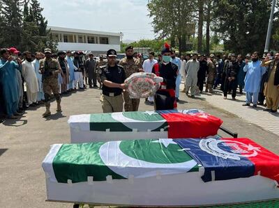 Police officials attend the funeral of two officers killed while guarding a polio vaccination team in Data Khel area of North Waziristan tribal region near the Afghan border, in Pakistan, in June. EPA