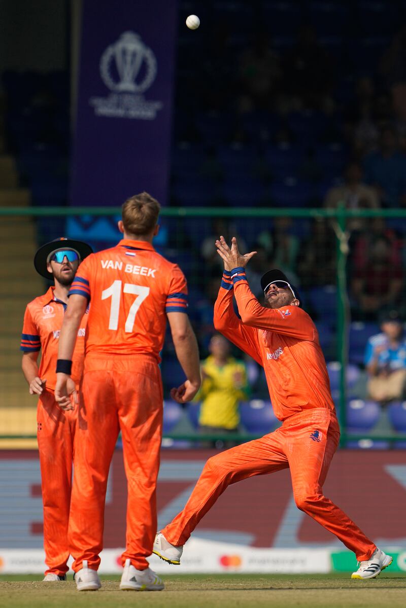 Netherlands Colin Ackermann, right, takes a catch to dismiss Australia's Mitchell Marsh. AP