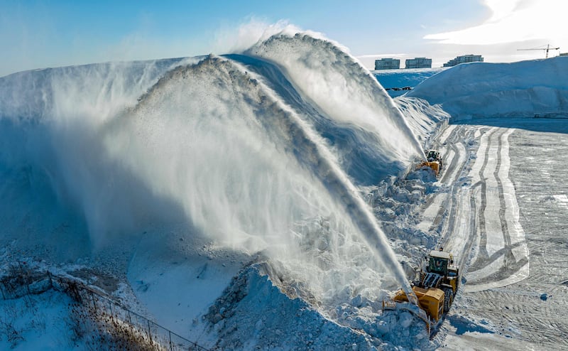 A snow removal operation in Montreal, Canada where, on average, snow-clearing vehicles are used 100 days or more each year. AFP

