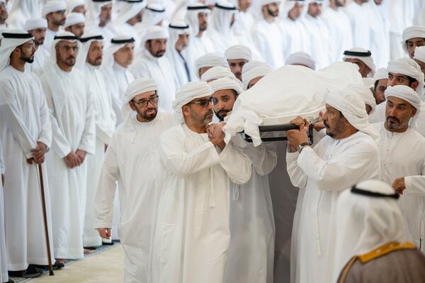 Sheikh Hazza's body is carried inside Sheikh Sultan bin Zayed the First Mosque in Abu Dhabi. Abdulla Al Bedwawi / Presidential Court