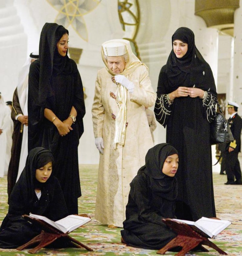 From left: Fatima al Melhi, cultural guide, Queen Elizabeth II, and Reem al Hashemy, Minister of State during her visit at the Sheikh Zayed Grand Mosque at the start of her second state visit to the UAE on November 24, 2010. Philip Cheung / EPA