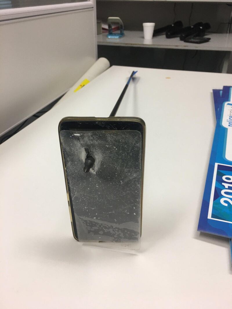 A picture shows an arrow that pierced a mobile telephone after accident in Nimbin, Australia March 13, 2019 in this picture obtained from social media on March 14, 2019.  NSW POLICE FORCE via REUTERS   ATTENTION EDITORS - THIS IMAGE HAS BEEN SUPPLIED BY A THIRD PARTY. MANDATORY CREDIT. NO RESALES. NO ARCHIVES.