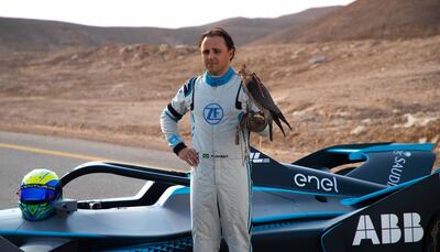 Massa poses with a falcon after winning the race. Formula E