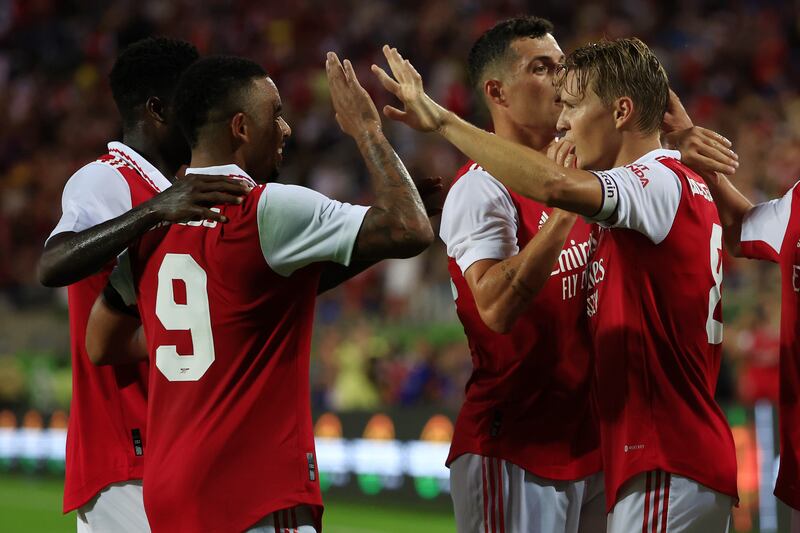 Martin Odegaard celebrates with Gabriel Jesus and Granit Xhaka after scoring Arsenal's second goal against Chelsea. Getty