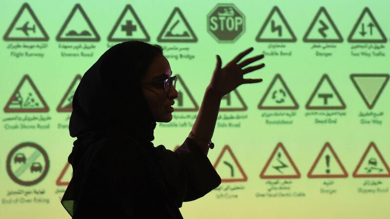 An employee of Careem, a chauffeur driven car booking service, talks during a training session for new female drivers, known in the company as "captains" at their Saudi offices in Khobar City, some 424 kilometres east of the Saudi capital of Riyadh, on October 10, 2017. 
Saudi Arabia's decision to allow women to drive had some sounding the death knell for ride-hailing apps like Careem, but its co-founder expects business to flourish and even plans to hire thousands of female drivers. / AFP PHOTO / FAYEZ NURELDINE