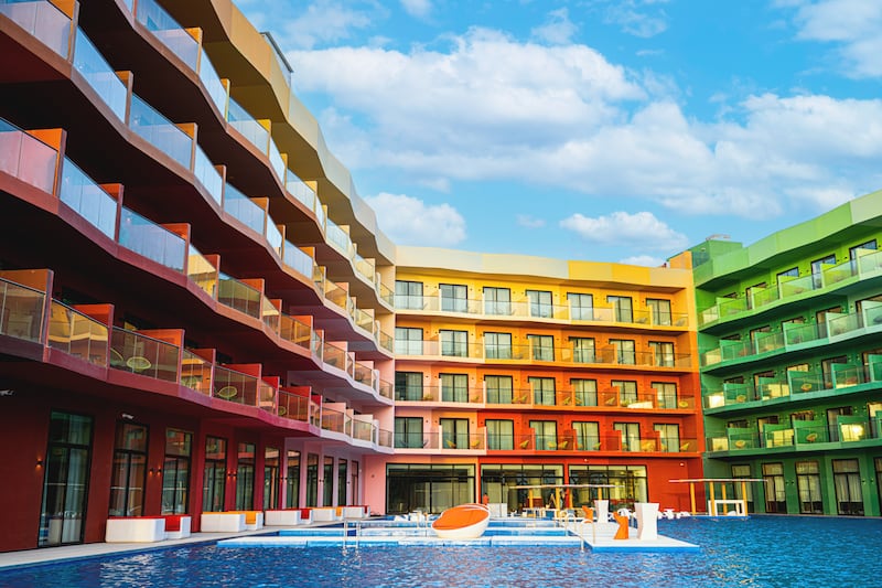 The Cote d’Azur Monaco Hotel looms over a large swimming pool, complete with submerged loungers. Photo: Cote d’Azur Monaco Hotel / Heart of Europe
