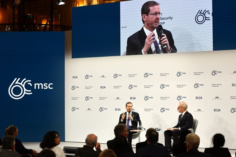 Israeli President Isaac Herzog (L) and American journalist David Ignatius (R) attend a panel talk at the 'Bayerischer Hof' hotel, the venue of the 60th Munich Security Conference (MSC), in Munich, Germany, 17 February 2024.  More than 500 high-level international decision-makers meet at the 60th Munich Security Conference in Munich during their annual meeting from 16 to 18 February 2024 to discuss global security issues.   EPA / ANNA SZILAGYI