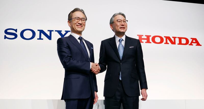 Sony Group chief executive Kenichiro Yoshida and Honda Motor chief executive Toshihiro Mibe announce the partnership to develop electric vehicles, in Tokyo. AP