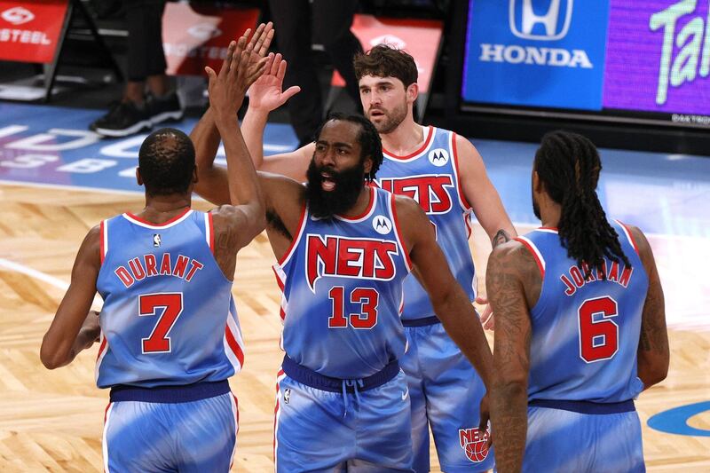 NEW YORK, NEW YORK - JANUARY 16: Kevin Durant #7, James Harden #13, Joe Harris #12, and DeAndre Jordan #6 of the Brooklyn Nets high-five during the first half against the Orlando Magic at Barclays Center on January 16, 2021 in the Brooklyn borough of New York City. NOTE TO USER: User expressly acknowledges and agrees that, by downloading and or using this Photograph, user is consenting to the terms and conditions of the Getty Images License Agreement.   Sarah Stier/Getty Images/AFP
== FOR NEWSPAPERS, INTERNET, TELCOS & TELEVISION USE ONLY ==
