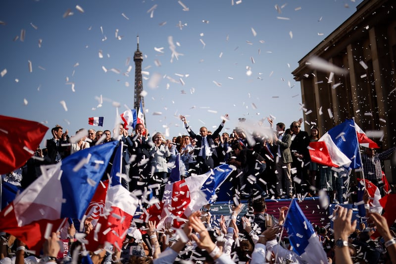 French far-right Reconquete party leader and 2022 presidential election candidate Eric Zemmour (C) throws his arms aloft at the end of a campaign rally at Trocadero in Paris. EPA