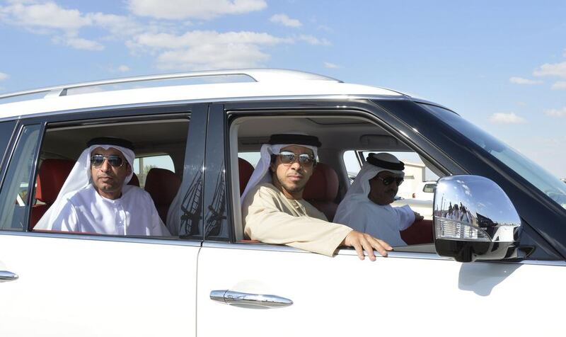 Sheikh Hamdan bin Mohammed, Crown Prince of Dubai (not pictured), Sheikh Mansour bin Zayed, Deputy Prime Minister and Minister of Presidential Affairs, and Sheikh Sultan bin Hamdan, Adviser to the President, Chairman of the Camel Racing Association and Chairman of Abu Dhabi Camel Racing Club, attend the finals of the Sheikh Zayed Camel Races Grand Prix Festival in Al Wathba, Abu Dhabi.