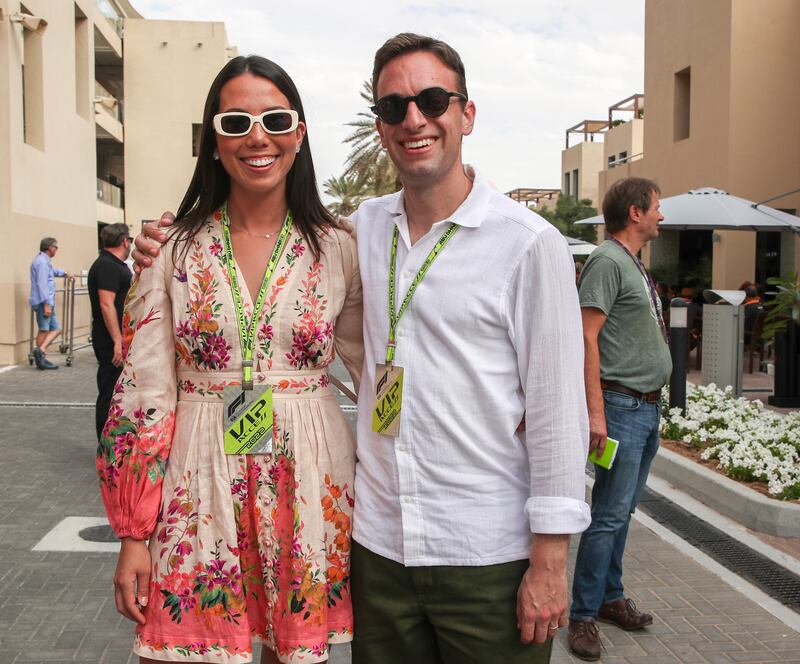 Emi Suzuki and Eric Tanner on championship race day behind the Pit Lane Walk at the Yas Marina Circuit in Abu Dhabi. Victor Besa / The National