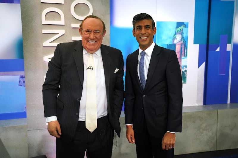 Veteran British journalist Andrew Neil stands with Rishi Sunak before he appears on 'The Andrew Neil Show'. PA