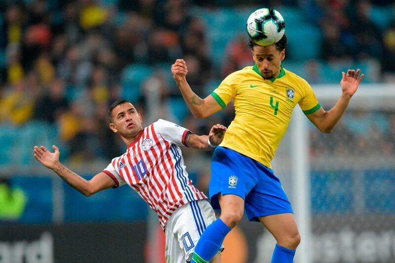 Paraguay's Derlis Gonzalez, left, and Brazil's Marquinhos go for the ball. AFP