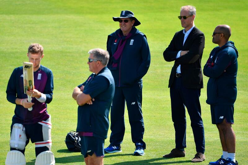 England's chief national cricket selector Ed Smith, second right, and head coach Trevor Bayliss watch on. AFP