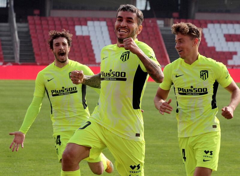 Angel Correa, centre, celebrates scoring Atletico Madrid's winner in their 2-1 La Liga win over Grenada on February 13. EPA