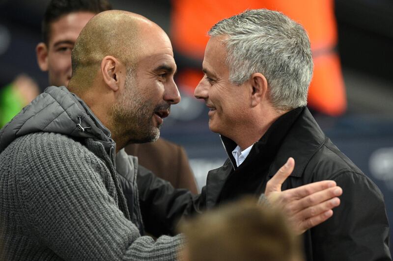 Manchester City's Spanish manager Pep Guardiola (L) greets Manchester United's Portuguese manager Jose Mourinho before the English Premier League football match between Manchester City and Manchester United at the Etihad Stadium in Manchester, north west England, on November 11, 2018. (Photo by Oli SCARFF / AFP) / RESTRICTED TO EDITORIAL USE. No use with unauthorized audio, video, data, fixture lists, club/league logos or 'live' services. Online in-match use limited to 120 images. An additional 40 images may be used in extra time. No video emulation. Social media in-match use limited to 120 images. An additional 40 images may be used in extra time. No use in betting publications, games or single club/league/player publications. / 