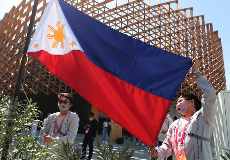 The Philippines flag flutters in the breeze.