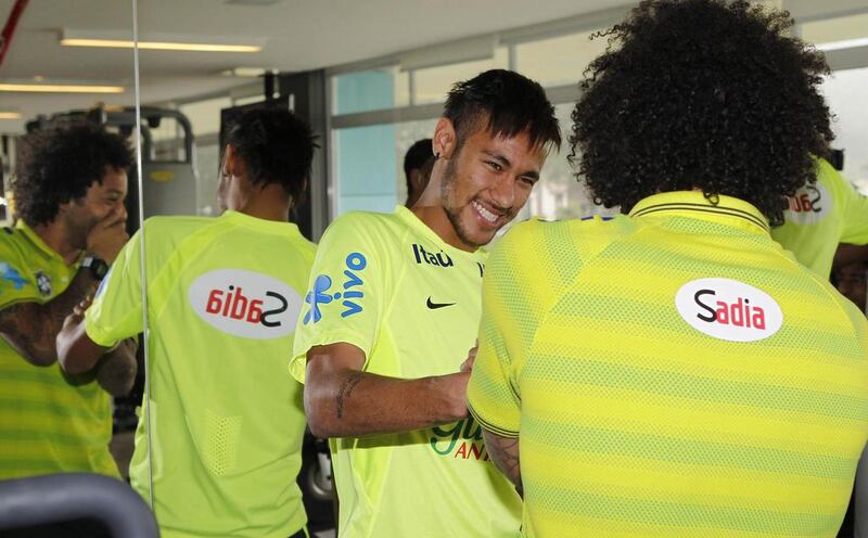 Brazil's Neymar talks with Marcelo at the side's training camp in Teresopolis on Tuesday. Rafael Ribeiro / Reuters / CBF / May 27, 2014