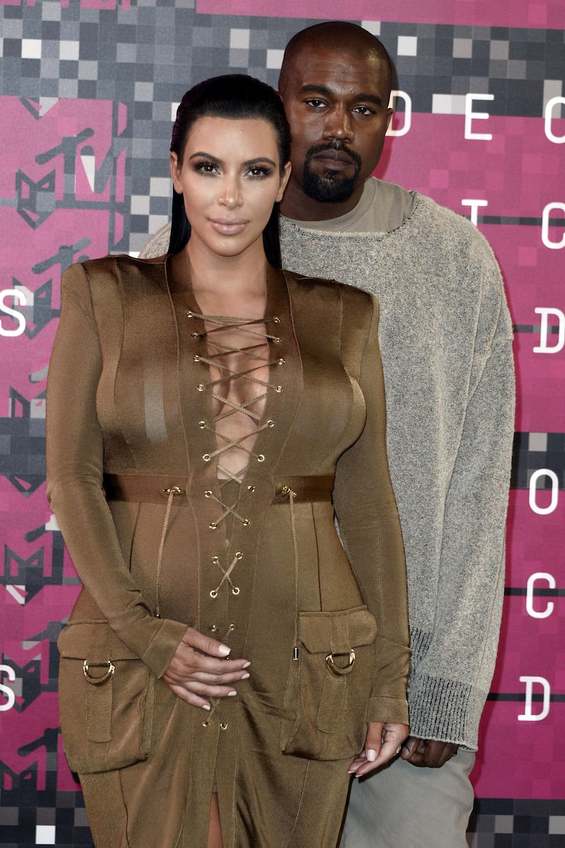 epa05567671 (FILE) A file photograph dated 30 August 2015 showing recording artist Kayne West (R) and TV personality Kim Kardashian (L) arriving on the red carpet for the 32nd MTV Video Music Awards at the Microsoft Theater in Los Angeles, California, USA. Reports on 03 October 2016 state that Kim Kardashian has been held at gunpoint and robbed of jewellery in her Paris hotel room.  Her husband US musician Kanye West stopped his concert in New York on hearing the news.  EPA/PAUL BUCK