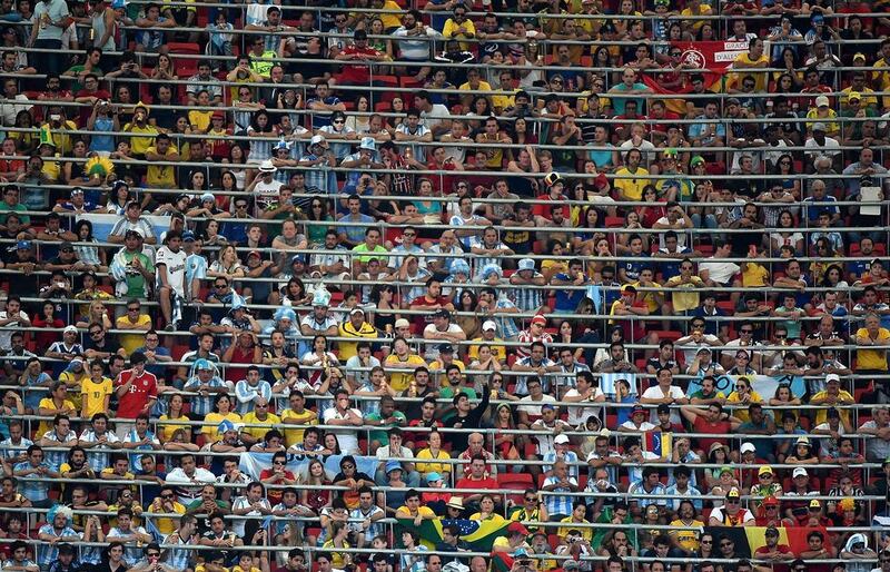 Football fans watch during the second half of the 2014 World Cup quarter-final football match between Argentina and Belgium at the Estadio Nacional Mane Garrincha in Brasilia, Brazil on Saturday. Christophe Simon / AFP