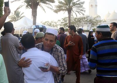 ABU DHABI - UNITED ARAB EMIRATES - 06JULY2016 - Residents of UAE embrace and wish each other Eid Mubarak after offering prayers on the occasion of Eid-Ul-Fitr at the Sheikh Zayed Grand Mosque yesterday in Abu Dhabi. Ravindranath K / The National (to go with Anwar story for News)   ID: 32547 *** Local Caption ***  on06jl-eid prayers-PG4.jpg