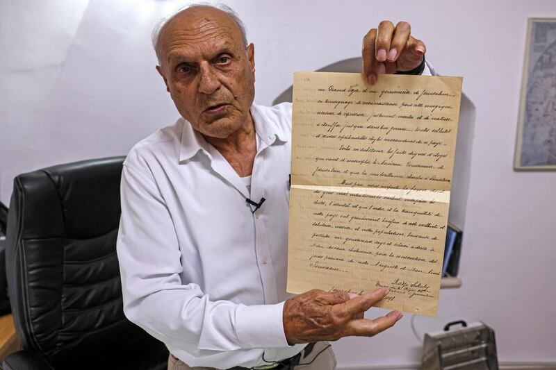 Khader with a letter written by Rawhi Al Khalidi, who was a consul for the Ottoman empire