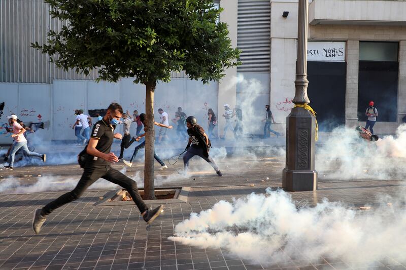 Tear gas is fired by the security forces towards demonstrators during a protest near parliament, as Lebanon marks the first anniversary of last year's explosion at Beirut port. Hundreds of Lebanese marched to remember the cataclysmic blast that ravaged the capital.