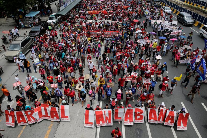 Activists march toward the Philippine Congress building to protest prior to Philippines president Rodrigo Duterte's State of the Nation Address. EPA