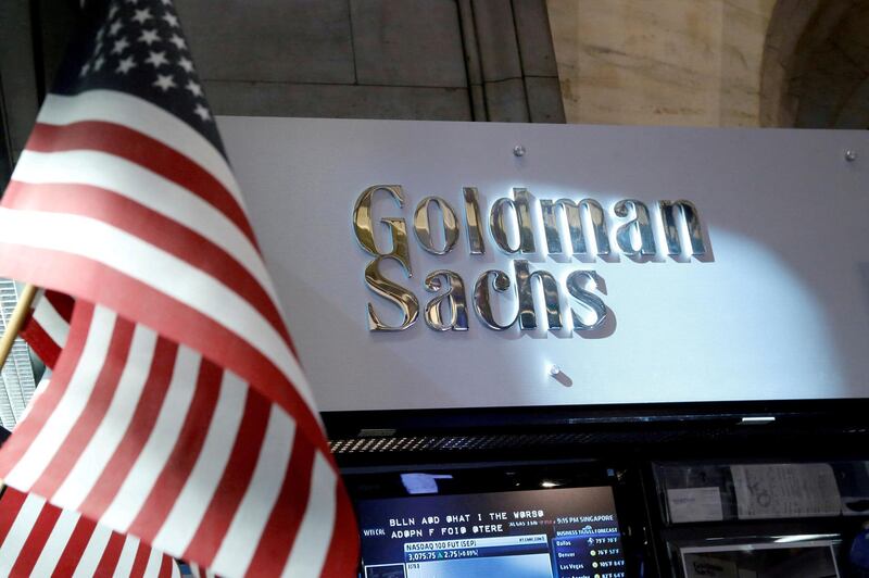 FILE PHOTO: A view of the Goldman Sachs stall on the floor of the New York Stock Exchange in New York, U.S. on July 16, 2013. REUTERS/Brendan McDermid/File Photo                         GLOBAL BUSINESS WEEK AHEAD