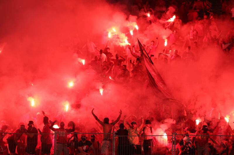 Wydad supporters light flares during the second leg of the CAF Champions League final. AFP