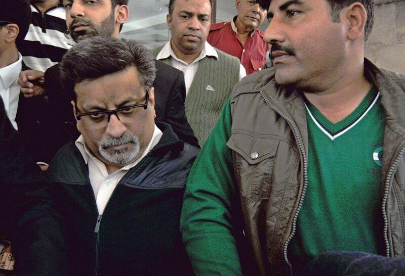 Rajesh Talwar, left, was found guilty of murder by the court in Ghaziabad. AFP Photo